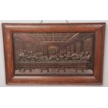 A oak framed bronze wall plaque depicting the last supper. (36cm x 65cm)