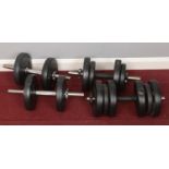 A quantity of dumbbell weights.