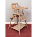 A child's wooden multi use high chair /desk. H:96cm, W:38.5cm. Condition fair. Some slight wood