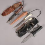 Three knifes all with sheaths. Including Japanese examples, etc.