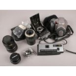 A collection of photographic equipment. Includes Soho Myna, Olympus, lenses, Pentax flash etc.