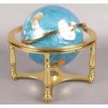A brass and hardstone table-top globe.