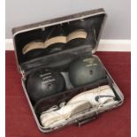 A cased ten pin bowling case. Includes Bruswick Black Beauty and Thunderbolt Power Core bowling