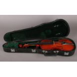 A cased child's Yamada violin. Doesn't come with a bow and will need extra strings. L: 53cm, W:15.