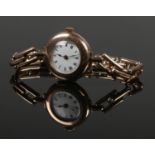 A ladies 9ct gold manual wristwatch. With 9ct gold expanding strap. 29.55g gross weight.