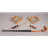 Vintage badminton rackets and hockey stick. To include a Dunlop Maxply Fort racket with Dunlop