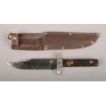 A 'Scale Tang Bowie' Knife. Comprising of a heavy nickel guard and stag horn handle with carbon