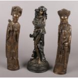 A pair of composite oriental figures along with a bronze effect figure by Regency fine art.
