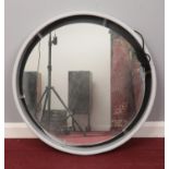A large framed circular electrical mirror. H: 77cm. Condition fair. The light doesn't seem to be
