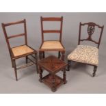 Three Mahogany chairs with small table. Comprising of two matching chairs with bergere seats, a