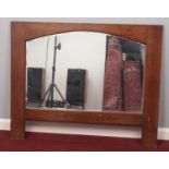 A large Oak framed bevelled edged mirror. H: 92cm, W:114cm. Condition good. Just scuffs and