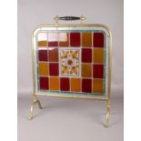 A brass framed stained glass fire screen. Comprising of a hand-painted floral central panel. H: