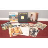 A group of LP vinyl records. The kinks, The Beatles, Paul Simon, Lighthouse family and other