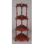 A carved mahogany four tier watt not stand. (143cm tall)