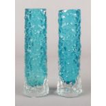 A pair of Whitefriars bark effect kingfisher blue glass cylinder vases. 14cm.