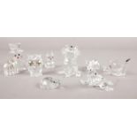 A group of nine Swarovski glass figures. Snowman, dog, owl, snail, rat, owl etc. Squirrel's tail