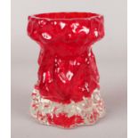 A Whitefriars style bark effect ruby red glass vase. 11cm.