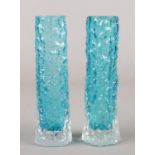 A pair of Whitefriars bark effect sky blue glass cylinder vases. 14cm.