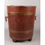 A coopered oak and brass coal bucket. Height 42cm, Diameter of top 36cm.