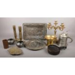 A collection of metalwares. Includes brass candlesticks, pewter, pestle and mortar etc.
