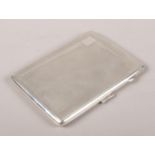 A silver cigarette case. Assayed Birmingham 1938 by W H Manton Ltd.