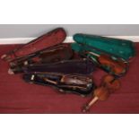 Four antique violins for restoration. Three in cases.