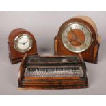 Two art deco mantle clocks, together with a wooden desk tidy. Comprising of an Oak Foreign mantle