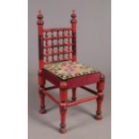 An Eastern red lacquer marriage chair.