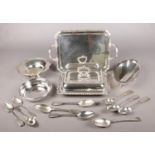 A collection of silver plated items. Includes tureen, tray, dishes, table spoons etc.