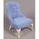 A shallow buttoned spoon back bedroom chair with.