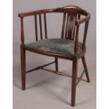 An Edwardian mahogany inlaid bentwood armchair.