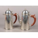 A George V silver chocolate pot and hot water jug, Assayed London 1932 by Goldsmiths &