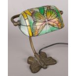 A Tiffany style desk lamp. Decorated with a dragonfly.