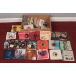 A large collection of various single 45 rpm vinyl records. To include 60's to 80's, David Bowie, Nat