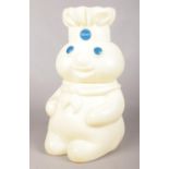 A plastic 'Pillsbury Doughboy' flour/cookie jar with twist head. (1996) H:33cm.