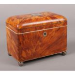 A Victorian tortoise shell tea caddy with a hinged lid and two sections to the interior. 14cm x 18cm