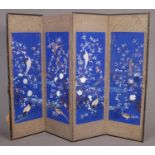 A Chinese four fold screen decorated with hand painted and embroided birds. (Height 171cm)