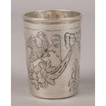 A 18th century Russian silver beaker. With embossed and chased decoration of eagles supported on