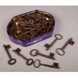 A tin of antique keys.