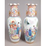 A pair of very large decorative oriental floor standing vases. Decorated with landscapes and