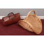 A vintage Gladstone bag along with a wicker basket.