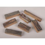 A quantity of antique copper printing blocks, depicting hand tools.