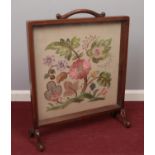 A mahogany fire screen with embroided panel. Front support loose.