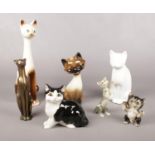 A group of vintage ornamental cats.