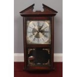 A 'President' Thirty one day pendulum wall clock. Comes with the pendulum, key and glass fronted