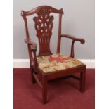 A Victorian style carved mahogany child's chair.