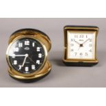 Two vintage Smiths travel alarm clocks.