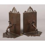 A pair of Austrian Art Deco bronze bookends. With textured grounds, openwork pediment and each