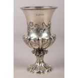 A Victorian silver chalice with repousse floral decoration, London 1841 by Joseph Angell I and