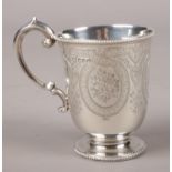 A Victorian silver cup with engraved decoration. Assayed London 1875 by Martin, Hall & Co. Minor